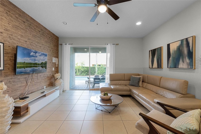 tiled living room featuring ceiling fan