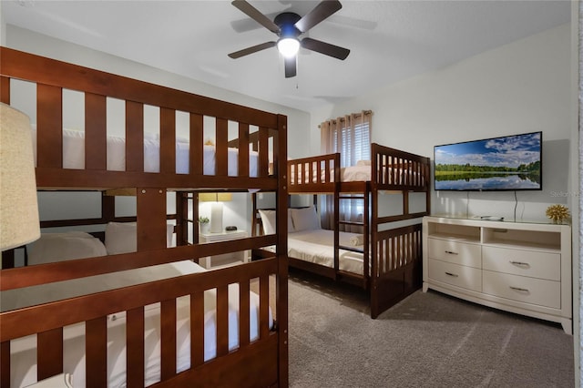 bedroom featuring dark colored carpet and ceiling fan