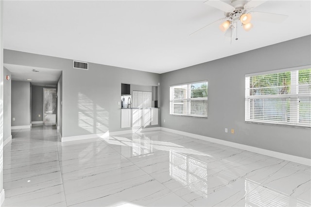 empty room featuring ceiling fan