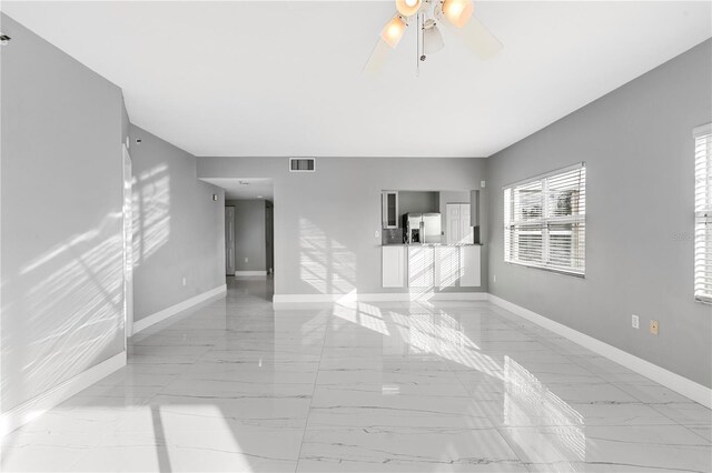 spare room with ceiling fan