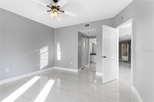 unfurnished room featuring ceiling fan