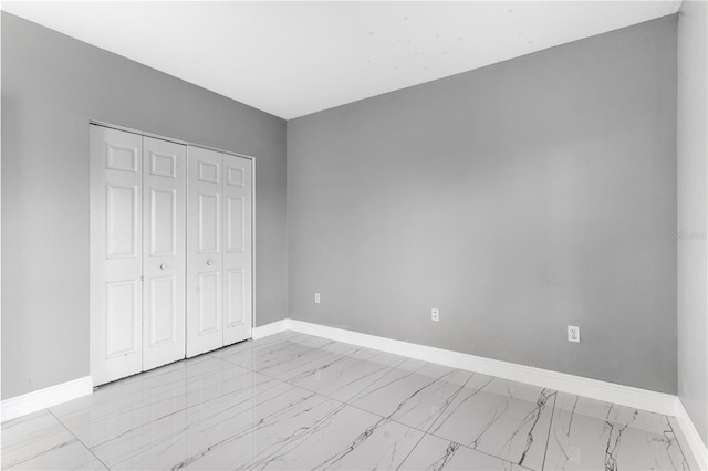 unfurnished bedroom with a closet