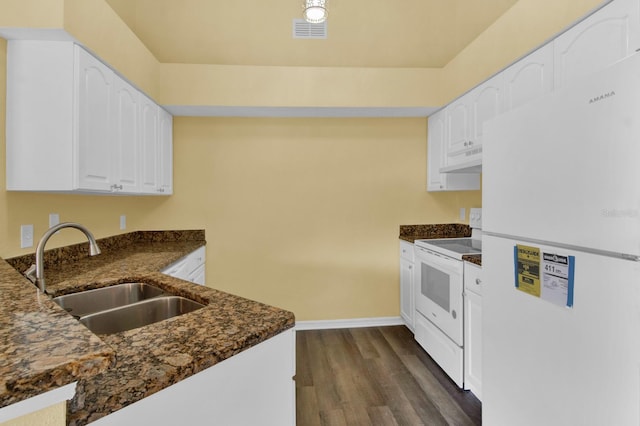 kitchen featuring white cabinets, white appliances, dark wood-type flooring, and sink