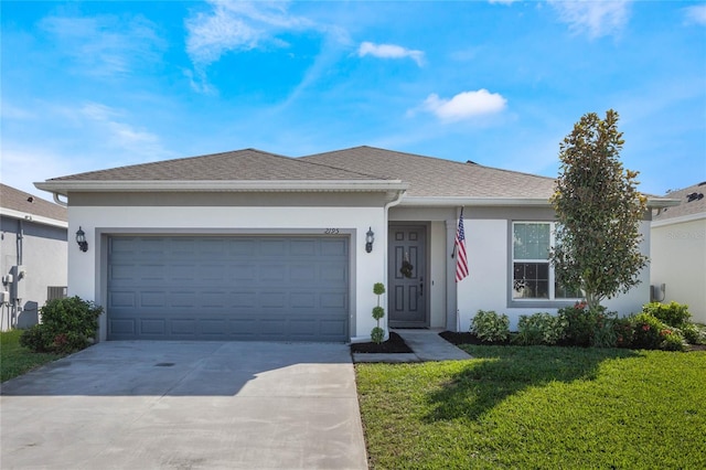 ranch-style home featuring a front yard and a garage