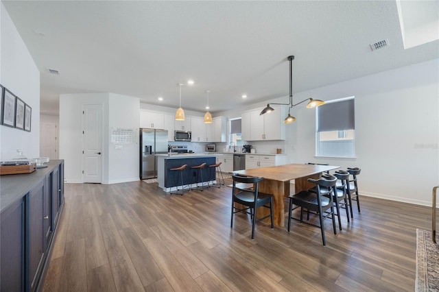 dining room featuring wood-type flooring