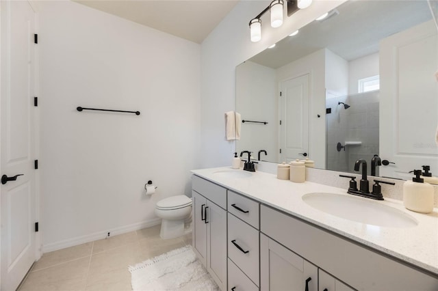 bathroom featuring vanity, tile patterned flooring, toilet, and an enclosed shower