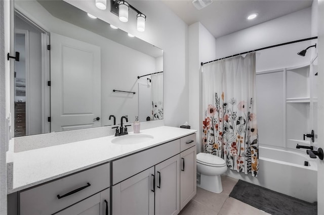 full bathroom featuring shower / tub combo with curtain, tile patterned flooring, vanity, and toilet