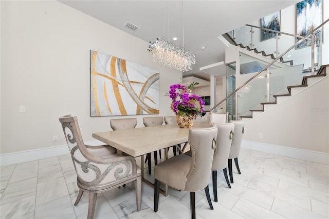 dining space featuring a chandelier