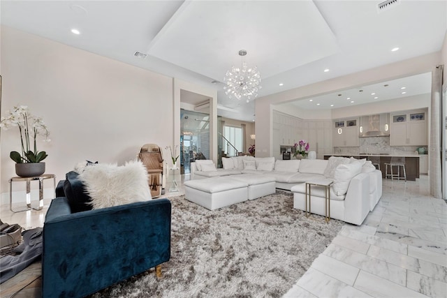 living room with an inviting chandelier