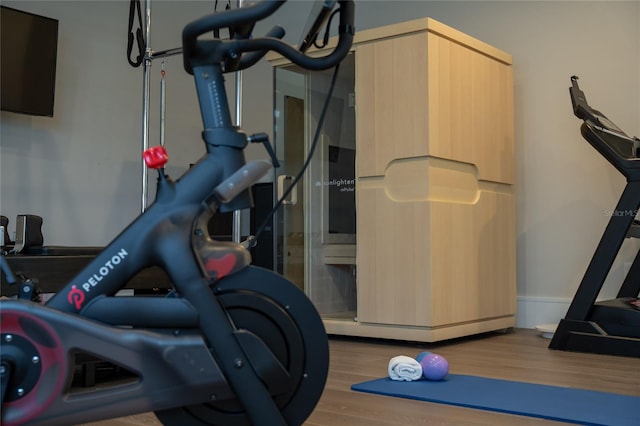 exercise area featuring hardwood / wood-style floors