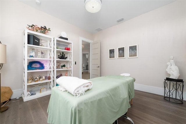 bedroom featuring dark hardwood / wood-style flooring