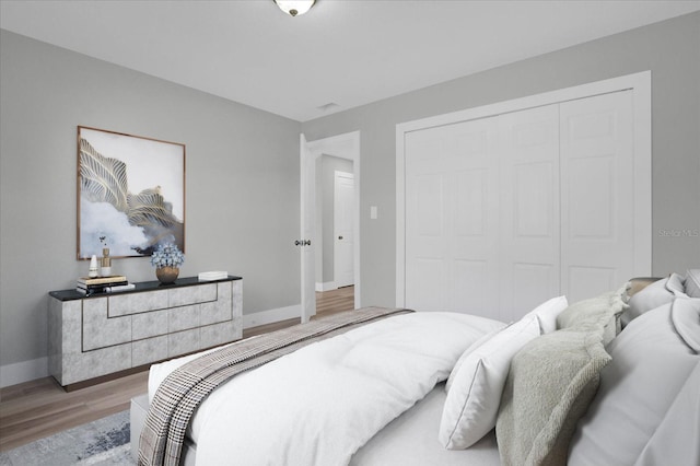 bedroom featuring a closet and light hardwood / wood-style flooring