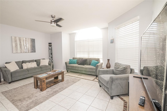 living room featuring ceiling fan and light tile patterned floors