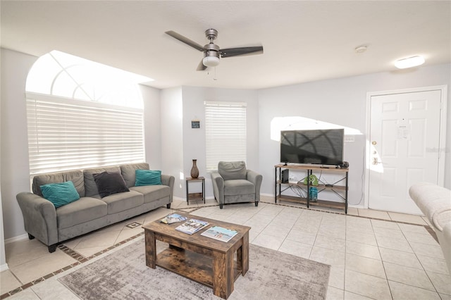 living room with ceiling fan and light tile patterned floors