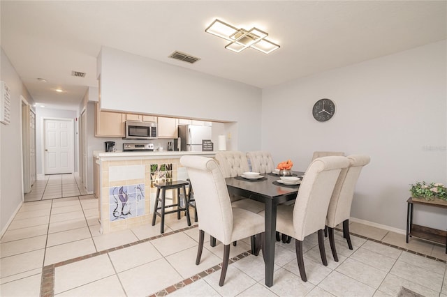 view of tiled dining space