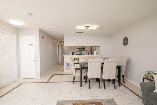 dining room featuring light tile patterned floors