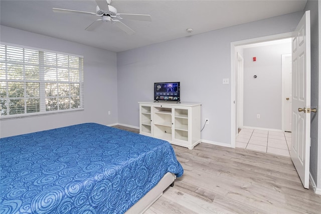 bedroom featuring light wood-type flooring and ceiling fan