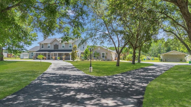 view of front facade featuring a garage and a front lawn