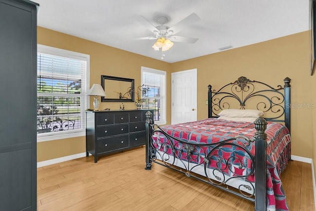 bedroom featuring ceiling fan and light hardwood / wood-style flooring