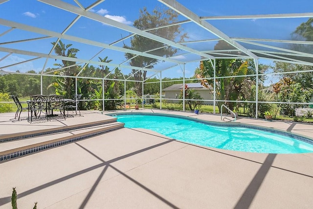 view of pool featuring a patio and a lanai