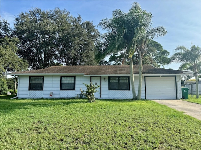 single story home with a garage and a front yard