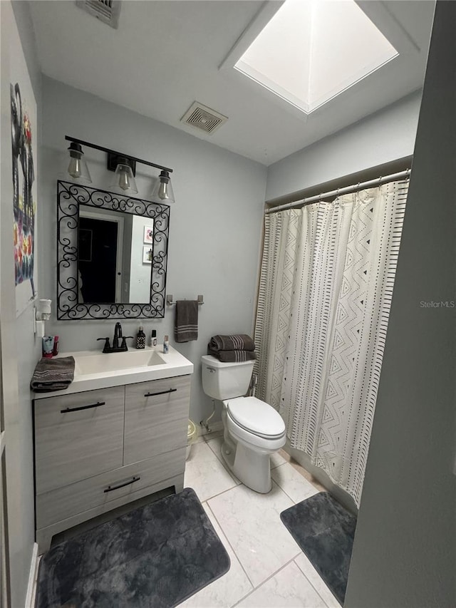 bathroom with tile patterned flooring, vanity, toilet, and a shower with shower curtain