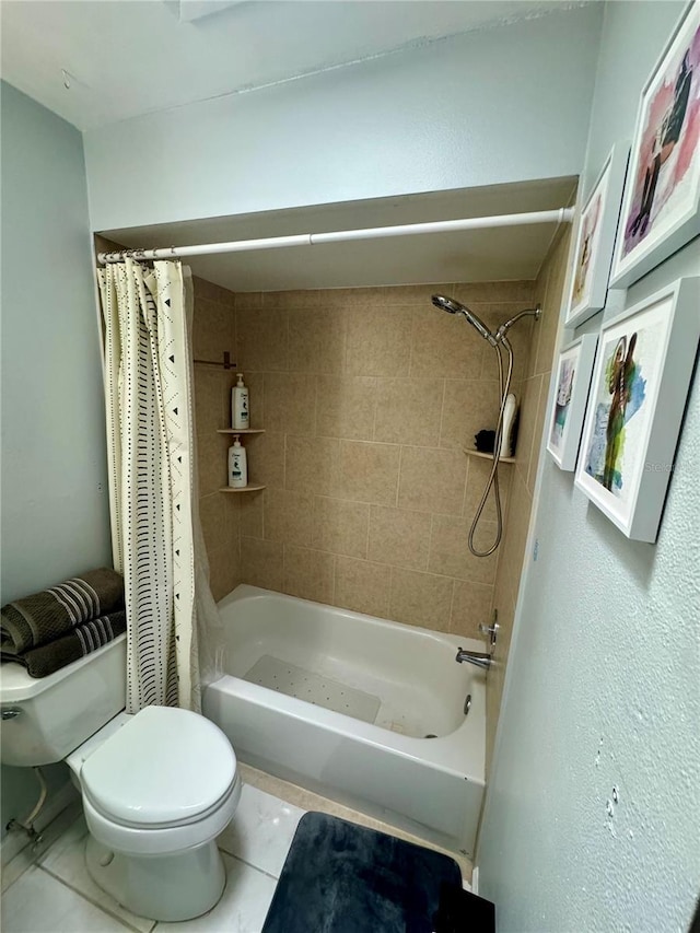 bathroom featuring shower / tub combo with curtain, tile patterned floors, and toilet