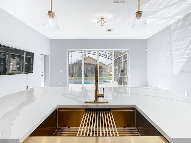 interior details with decorative light fixtures and sink