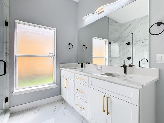 bathroom with vanity and a shower with door