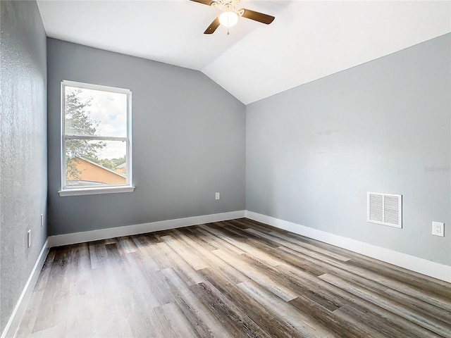 additional living space with lofted ceiling, hardwood / wood-style floors, and ceiling fan