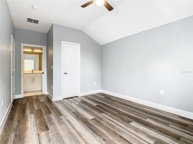 bonus room with dark wood-type flooring, vaulted ceiling, and ceiling fan