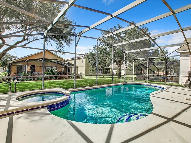 view of pool with a patio, a lanai, and a lawn