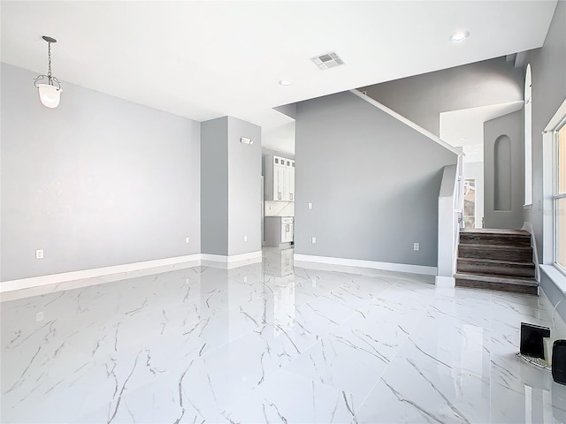 133 Andalusia Loop, Davenport, FL 33837 - unfurnished living room featuring recessed lighting, visible vents, marble finish floor, and baseboards