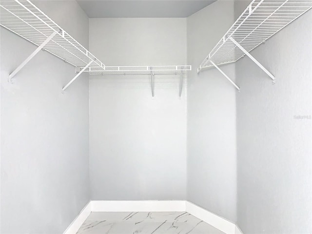 133 Andalusia Loop, Davenport, FL 33837 - walk in closet with marble finish floor