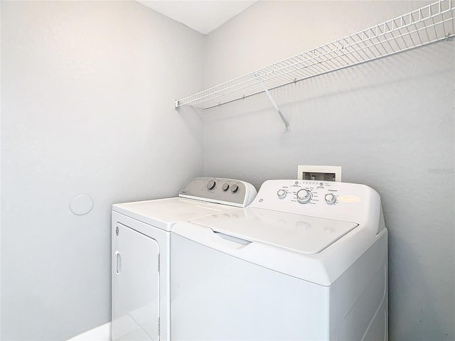 laundry area with separate washer and dryer