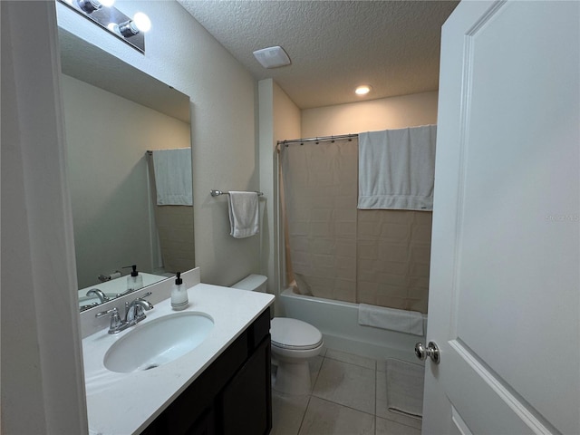 full bathroom with vanity, a textured ceiling, shower / tub combo, tile patterned floors, and toilet