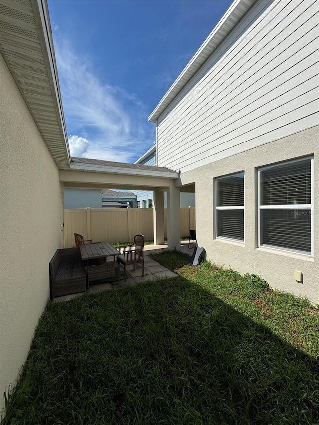 view of yard featuring an outdoor living space and a patio area