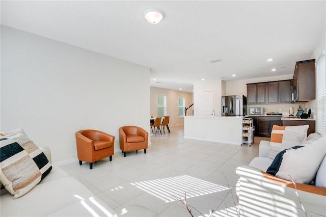 living room with light tile patterned flooring