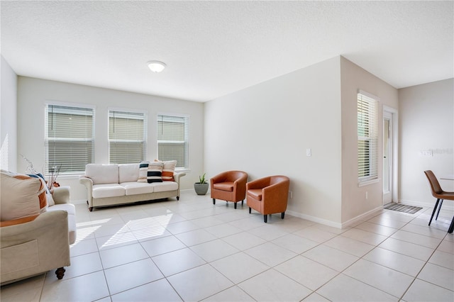 tiled living room with a textured ceiling