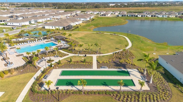 birds eye view of property with a water view