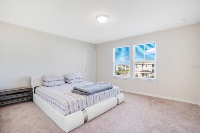 bedroom with light carpet