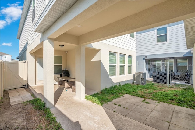 exterior space featuring central AC unit and a patio area