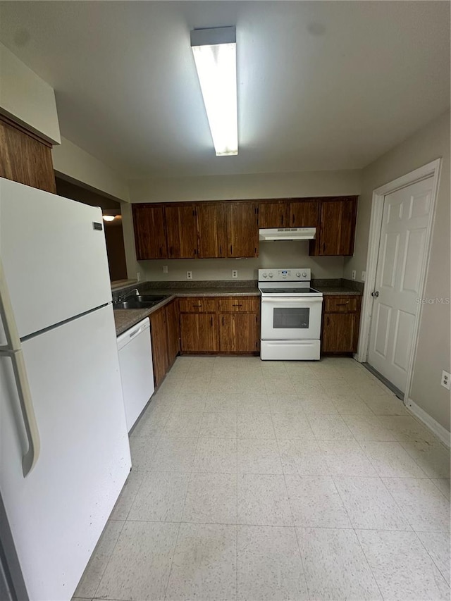 kitchen featuring white appliances and sink