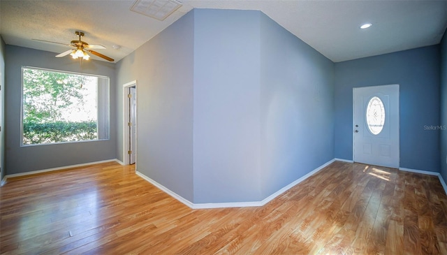 1501 NE 57th St, Ocala, FL 34479 - entryway featuring baseboards, a ceiling fan, visible vents, and wood finished floors