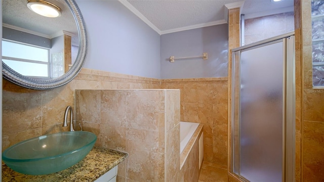 1501 NE 57th St, Ocala, FL 34479 - full bath with a stall shower, ornamental molding, tile walls, and a textured ceiling