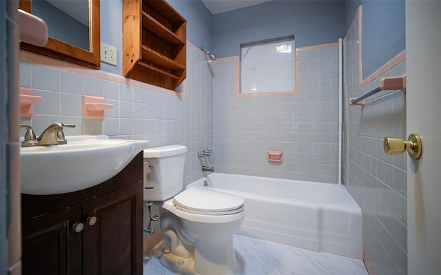 1501 NE 57th St, Ocala, FL 34479 - full bath featuring vanity, toilet, shower / washtub combination, and tile walls