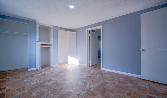 1501 NE 57th St, Ocala, FL 34479 - unfurnished bedroom featuring a textured ceiling, baseboards, stone finish flooring, and recessed lighting