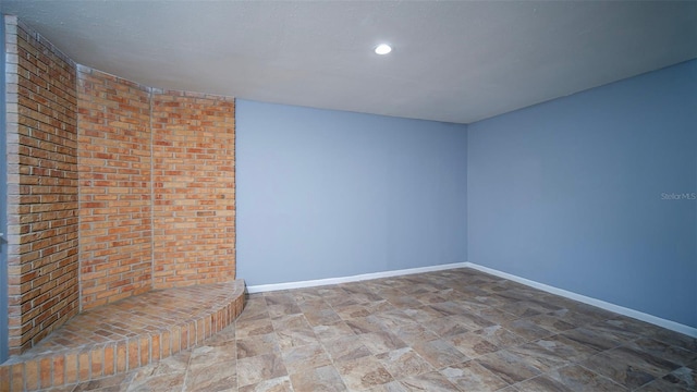 1501 NE 57th St, Ocala, FL 34479 - spare room featuring baseboards, stone finish flooring, and recessed lighting