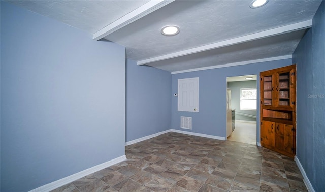 1501 NE 57th St, Ocala, FL 34479 - spare room featuring baseboards, visible vents, and stone finish floor