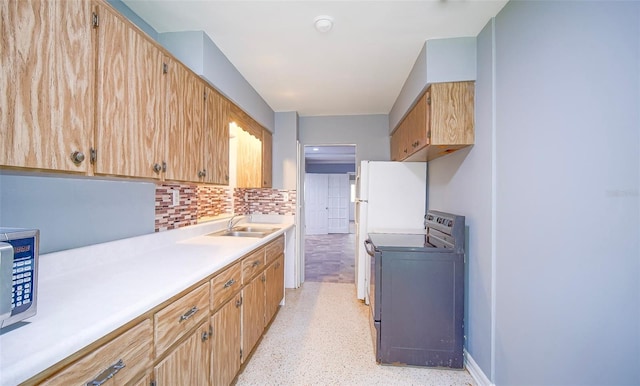 1501 NE 57th St, Ocala, FL 34479 - kitchen with a sink, stainless steel microwave, tasteful backsplash, range with electric stovetop, and light countertops
